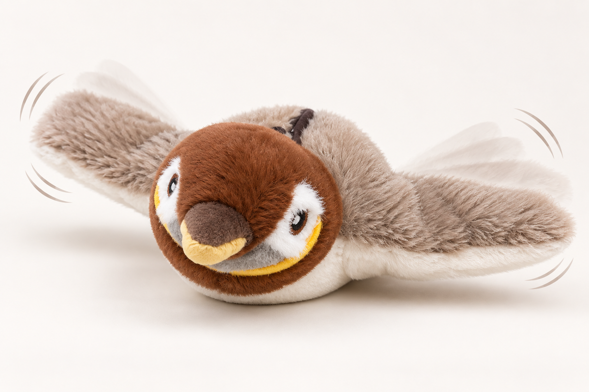 Plush bird cat toy on the floor with wing-motion depiction